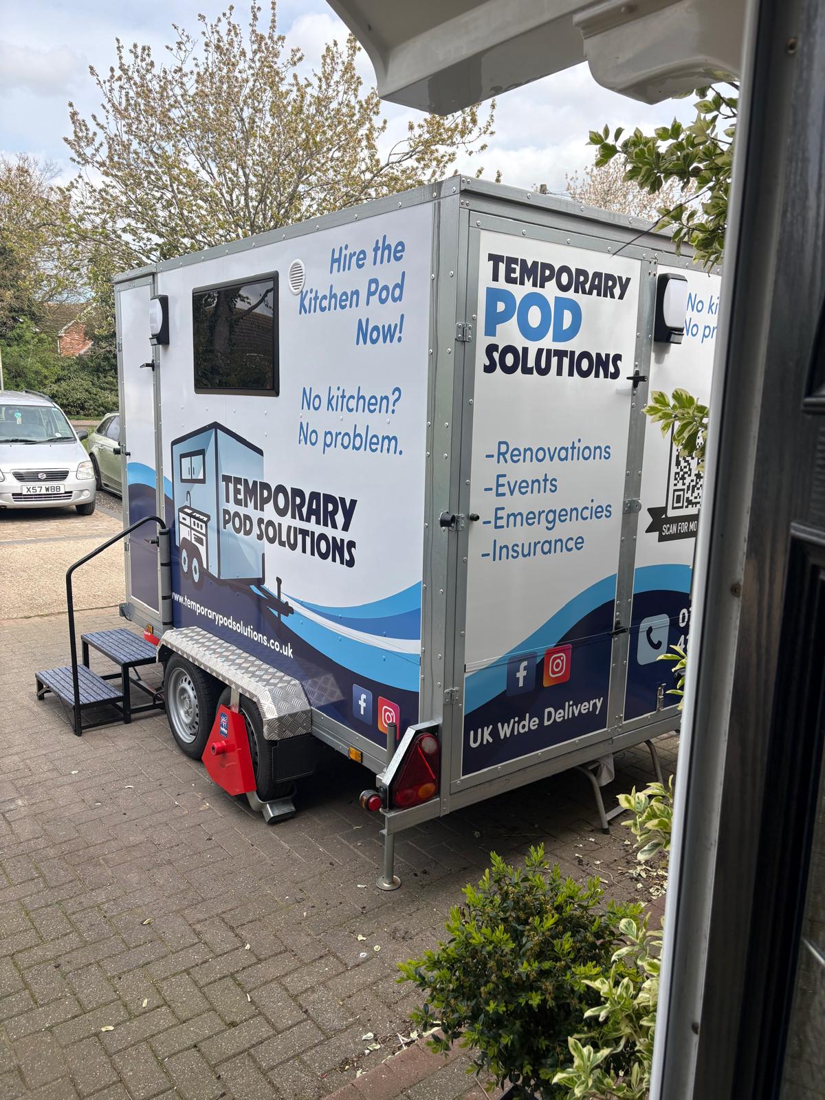 Kitchen pod exterior rear view showing Temporary Pod Solutions branding